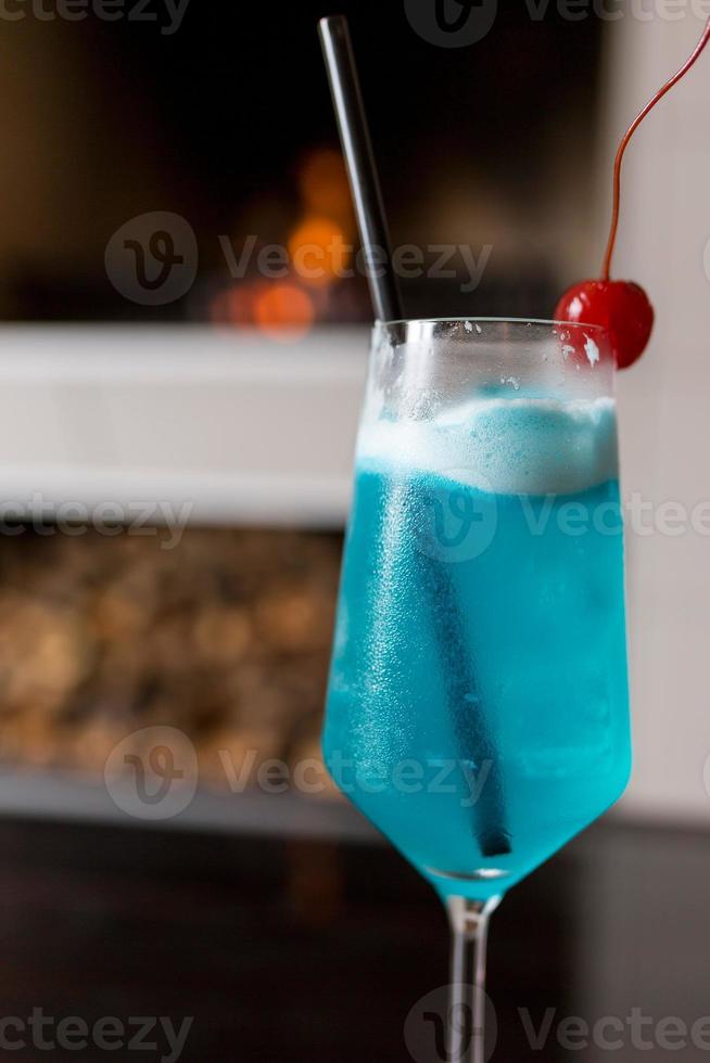Blue cocktail with fireplace photo