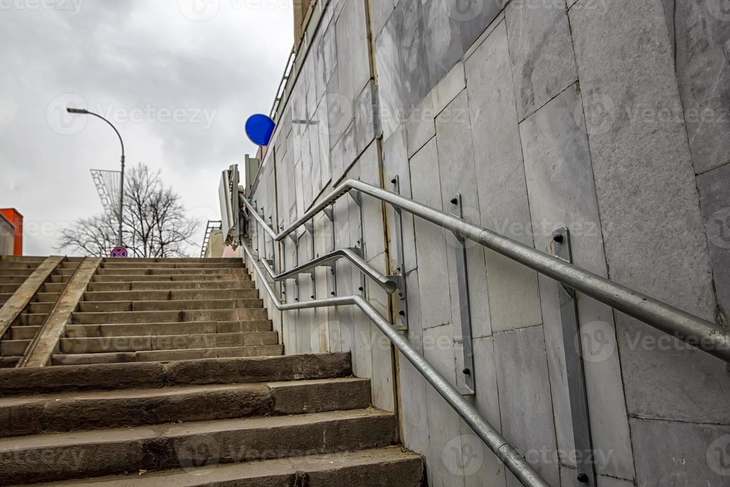 Inclined wheelchair lift for people with disabilities in the underpass photo