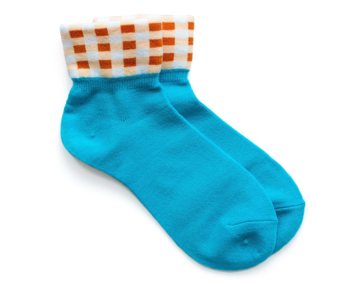 blue striped socks isolated on white background photo