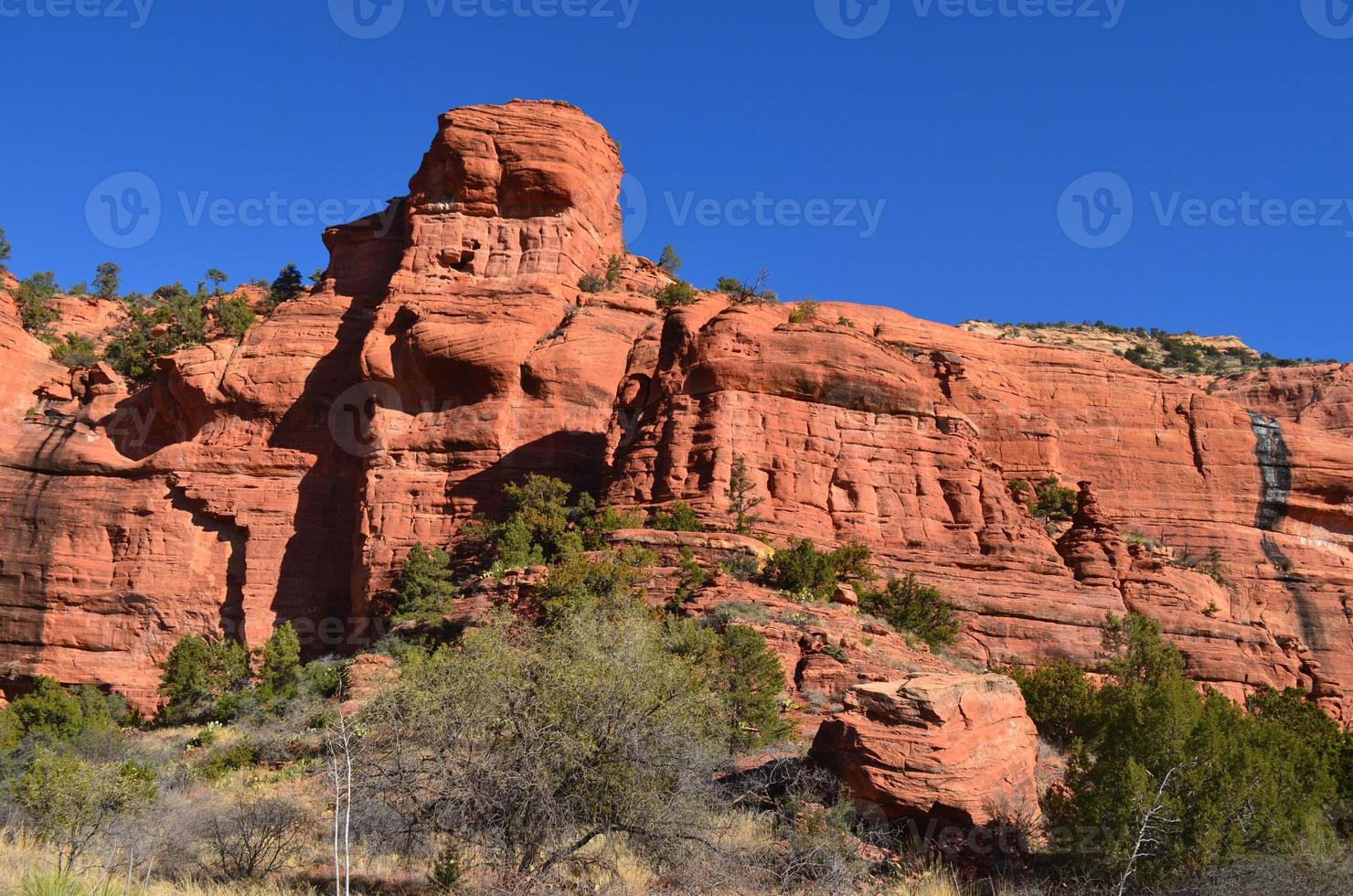 Dark Red Rock Cliff and Rock Formation photo