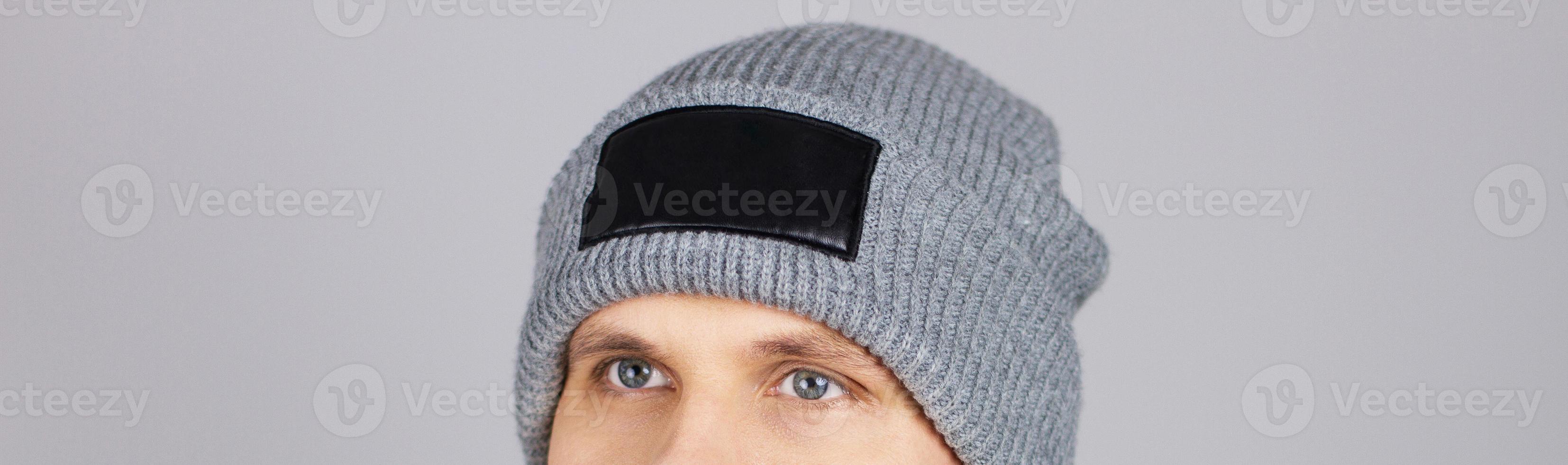 man in grey hat isolated, hipster in empty winter hat,copy space,mock up - cropped image photo