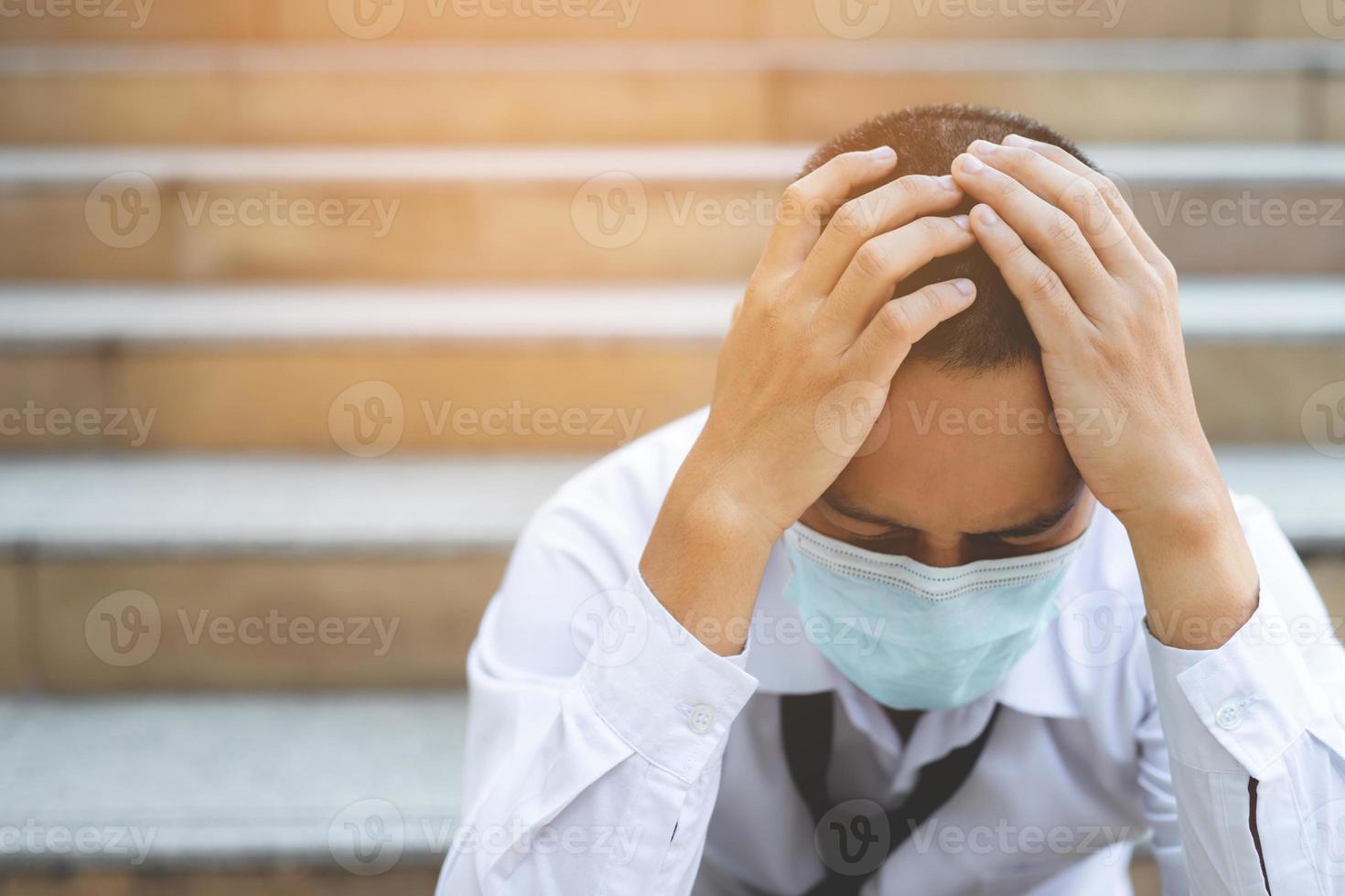 Businessman sitting stressed. Business bankrupt from Covid-19. photo