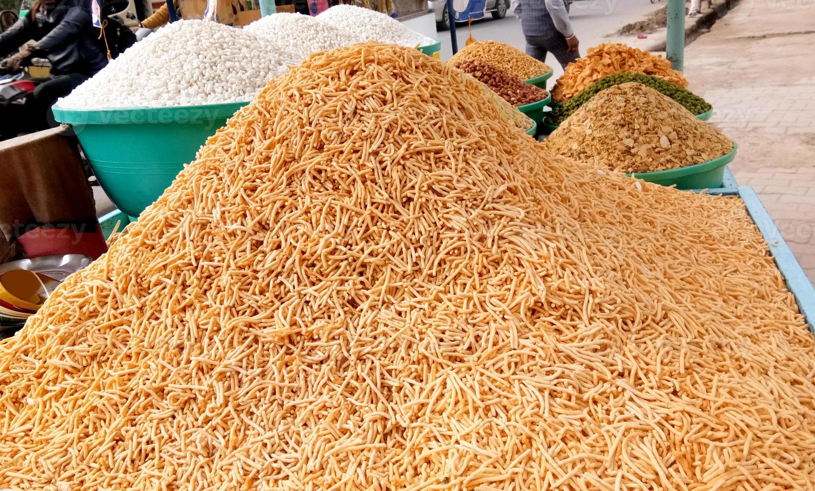 A street vendor selling a famous crispy snack - Churmura and namkeen bhujia photo