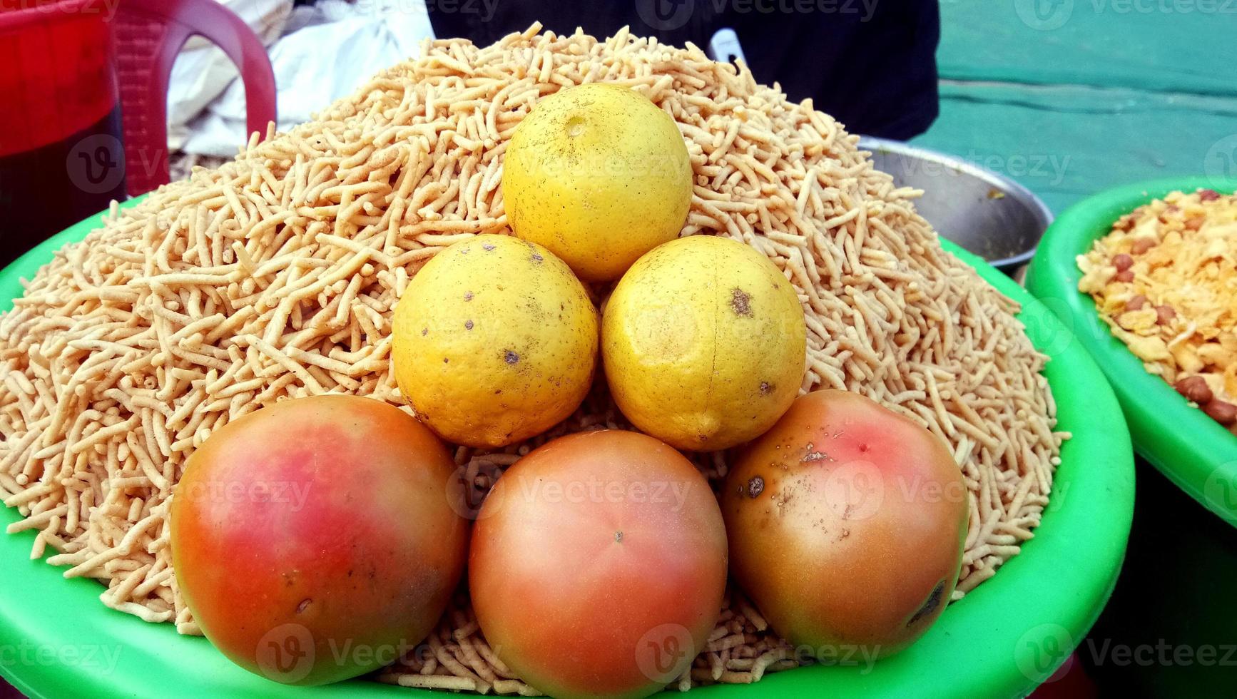 A street vendor selling a famous crispy snack - Churmura and nam photo