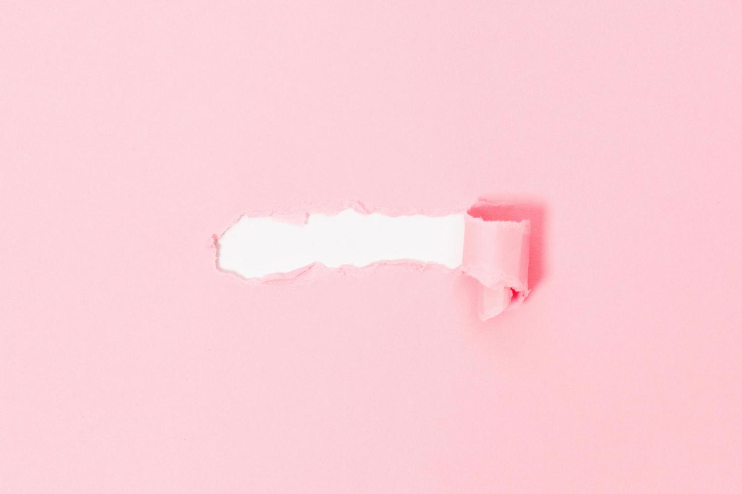 Top view of pink torn paper on white background. Free space for text banner photo