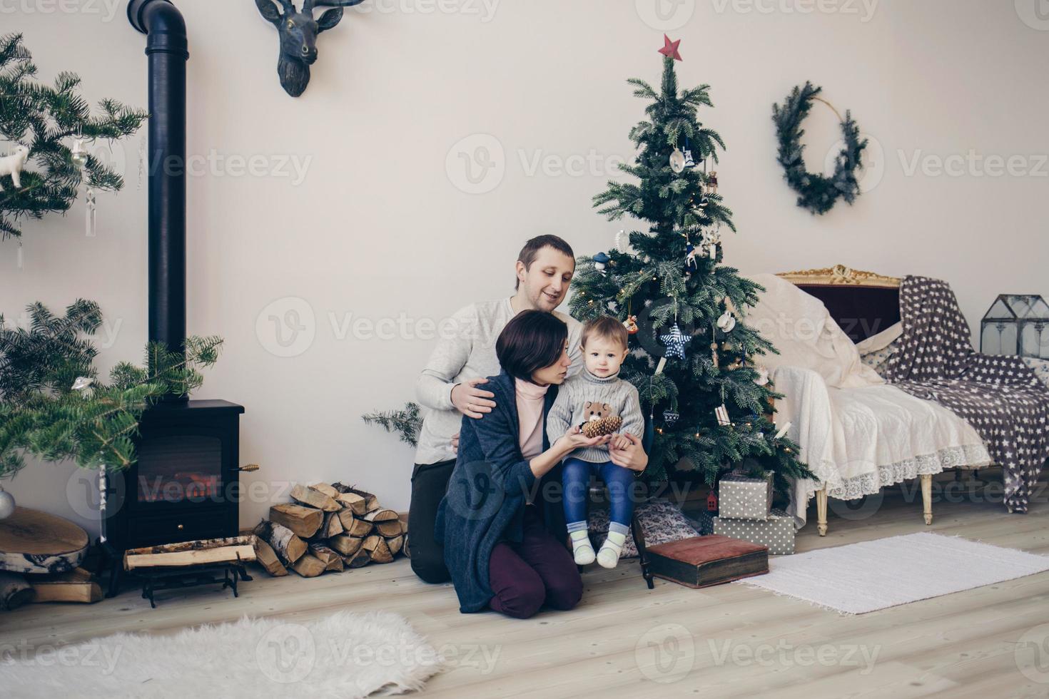 happy family in a decorated Christmas apartment photo