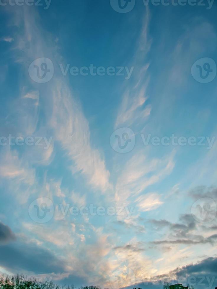 Feather clouds in the shape of an angel are visible in the sky. The photo was taken on the day of the Archangel Michael