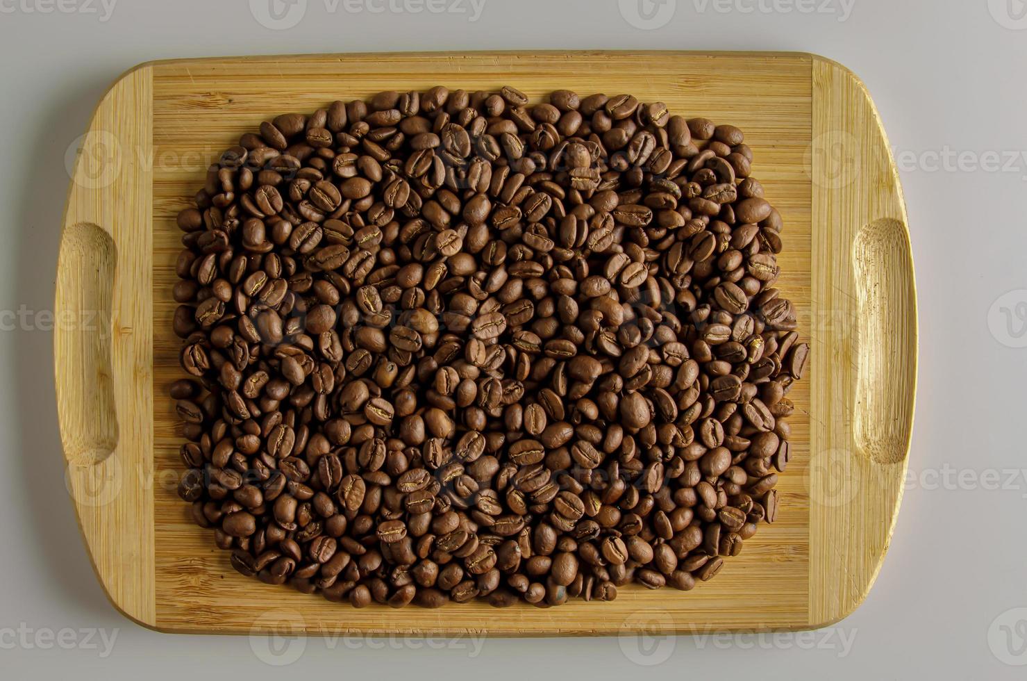 Roasted Cuban coffee of the highest quality. Background of coffee beans on a wooden board photo