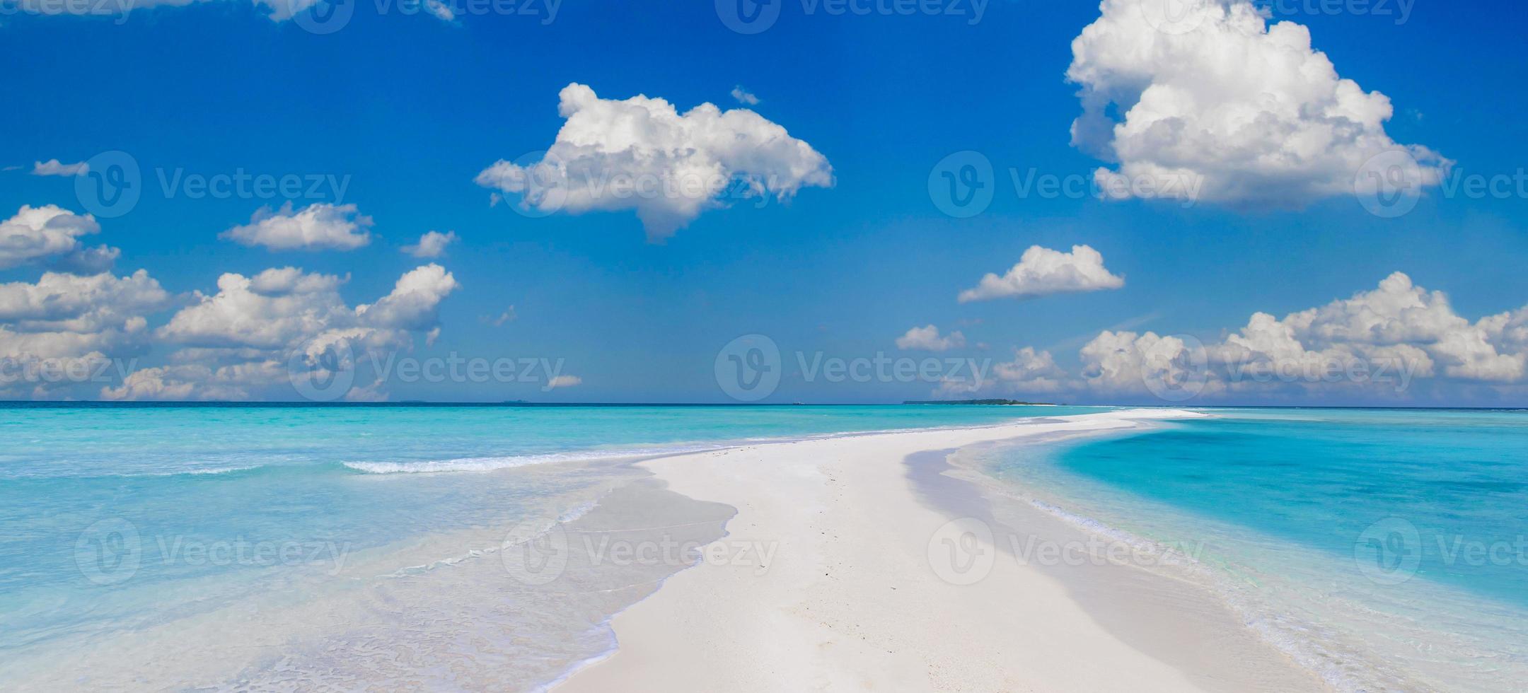 Beautiful tropical island beach on background blue sky with white clouds and turquoise ocean sunny day. Perfect natural sandbank landscape as summer vacation beach, ultra wide format. Amazing nature photo