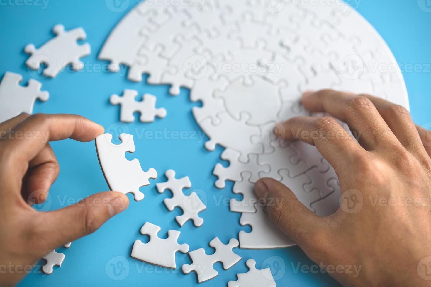 Closeup hand of woman connecting jigsaw puzzle, Business solutions, success and strategy concept photo