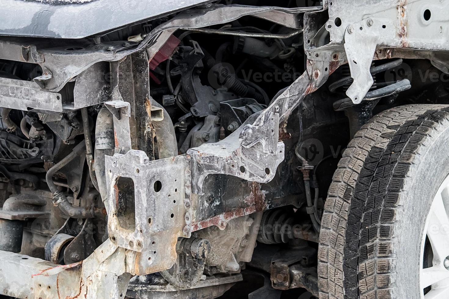 Broken car after accident on road. Auto without bumper and headlights. Insurance concept. photo