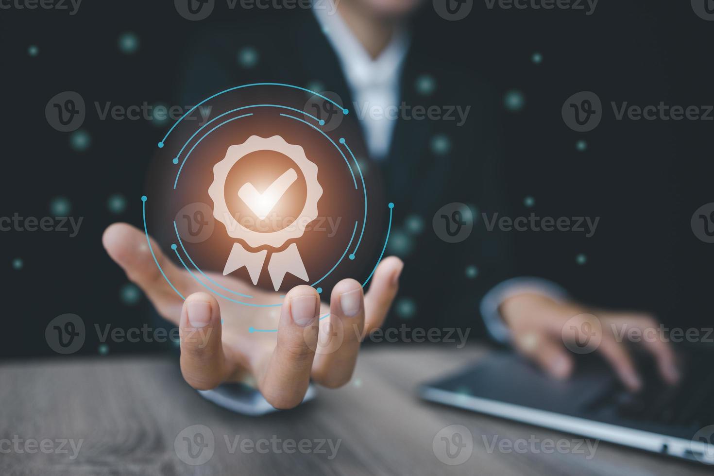 Hand shows the sign of the top service Quality assurance, Guarantee, Standards, ISO certification and standardization concept. photo