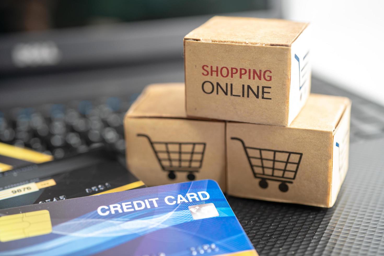 Shopping online box with credit card on laptop computer. Finance commerce import export business concept. photo