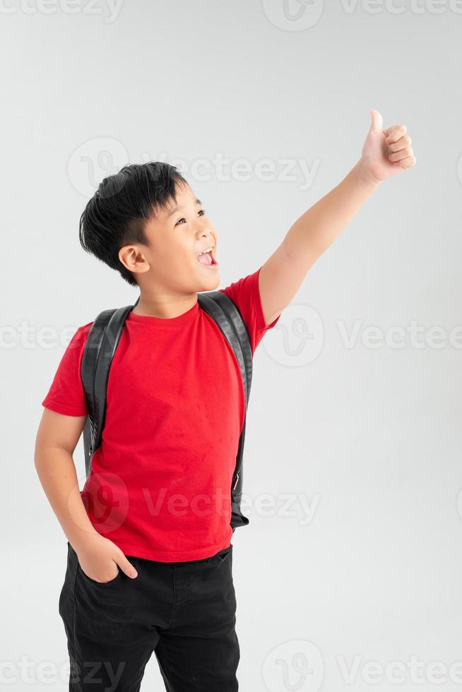 Successful school giving thumb up isolated on white background photo