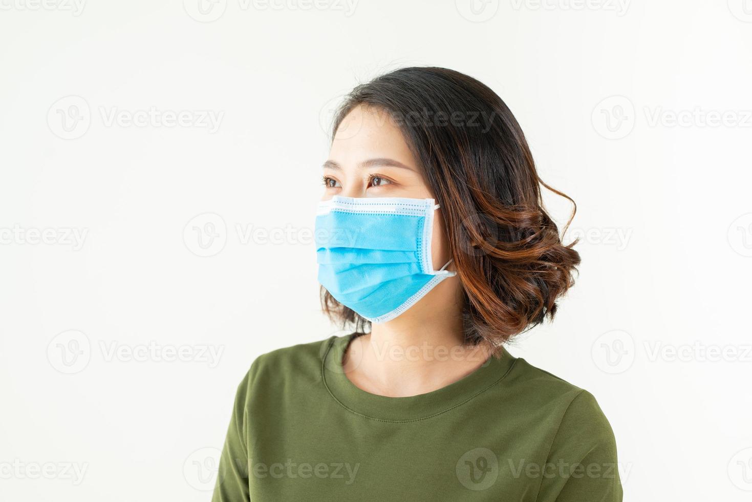 A Woman wears a mask to protect from virus, asian beauty, white background photo