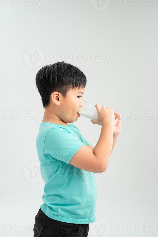 A drinking milk boy on the white background. photo