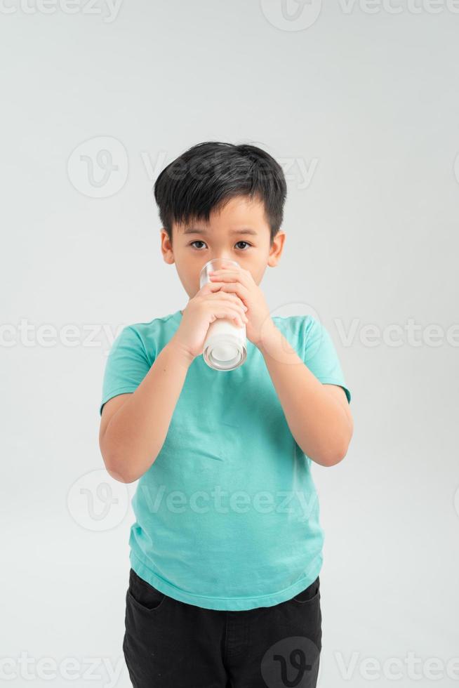 A drinking milk boy on the white background. photo