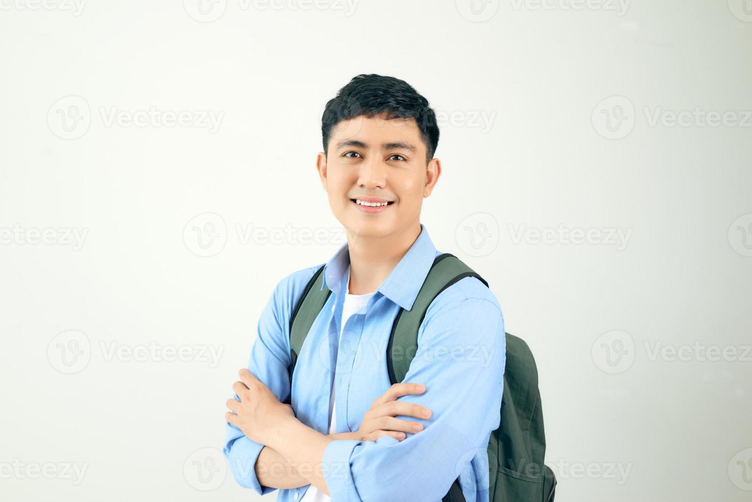Handsome and friendly face man self-confident positive expression with crossed arms on white background photo