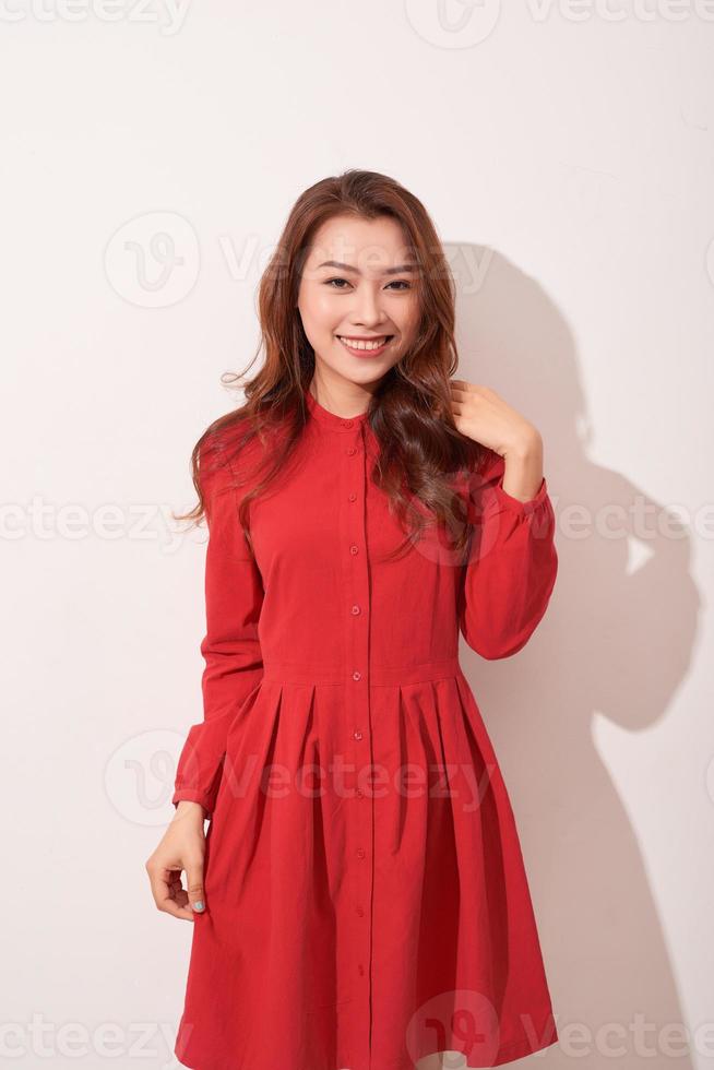 Beautiful female model posing in red clothes photo