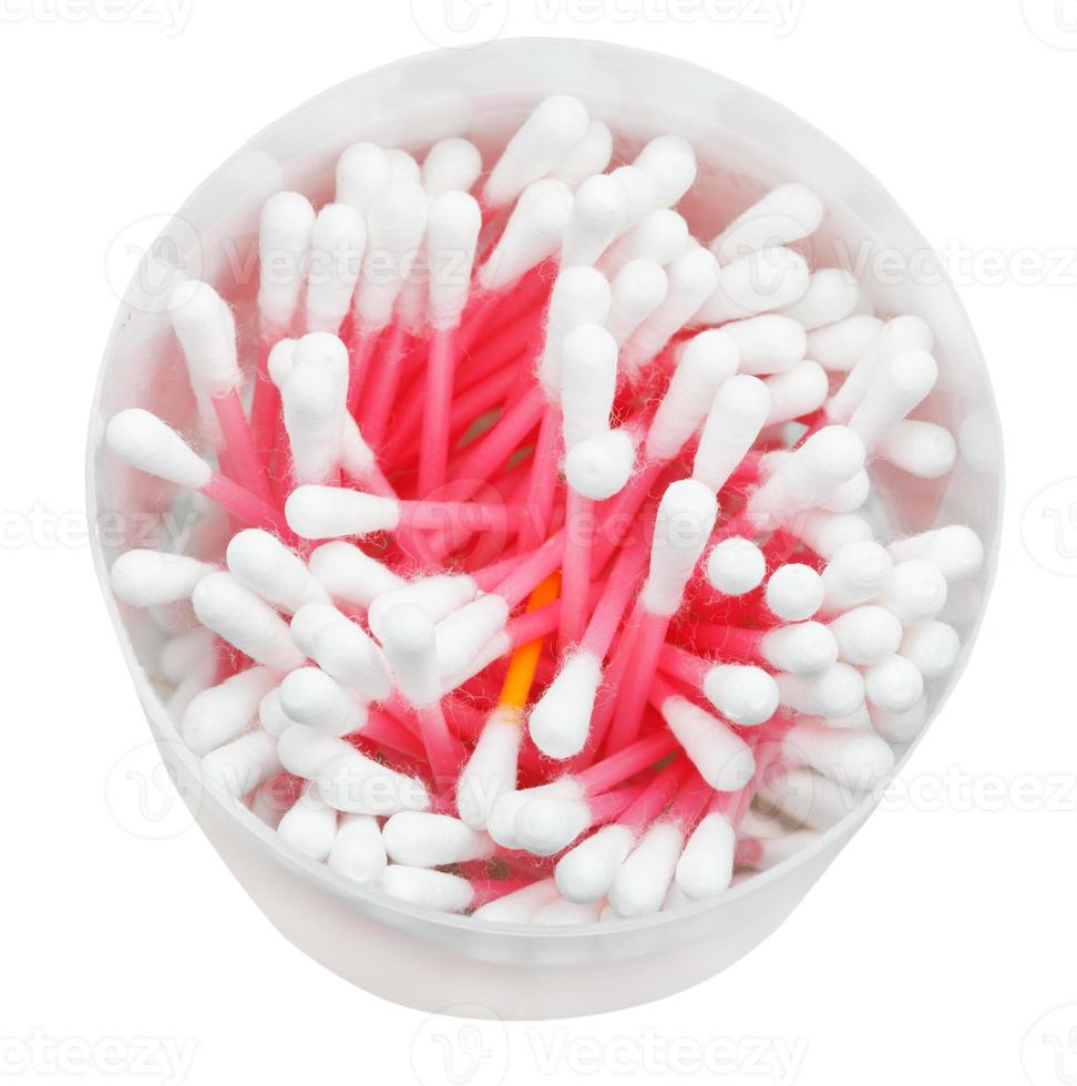 Many pink cotton swabs in round container photo
