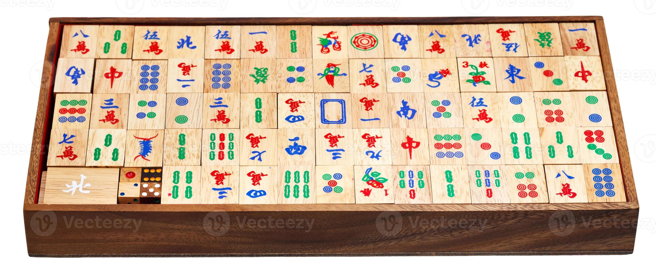 mahjong game tiles in box isolated on white photo