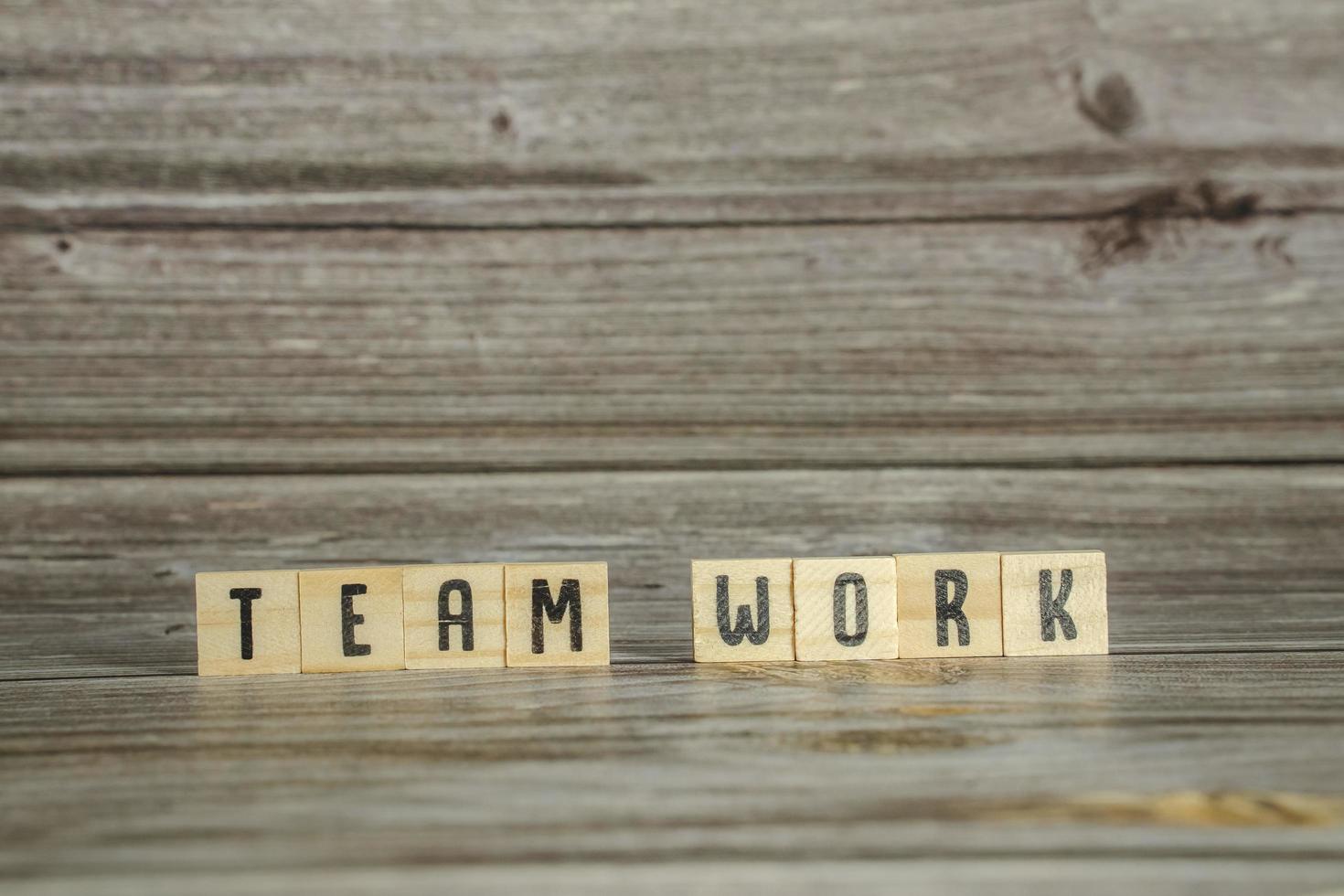 the word of TEAMWORK on wood tiles concept photo