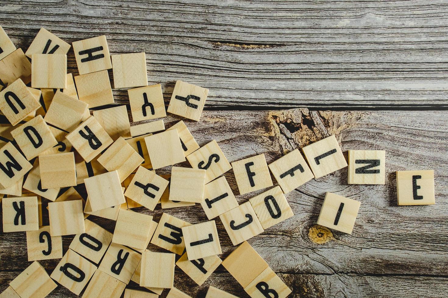 empty space on a wooden background Word Written In Wooden Cube on wood background photo