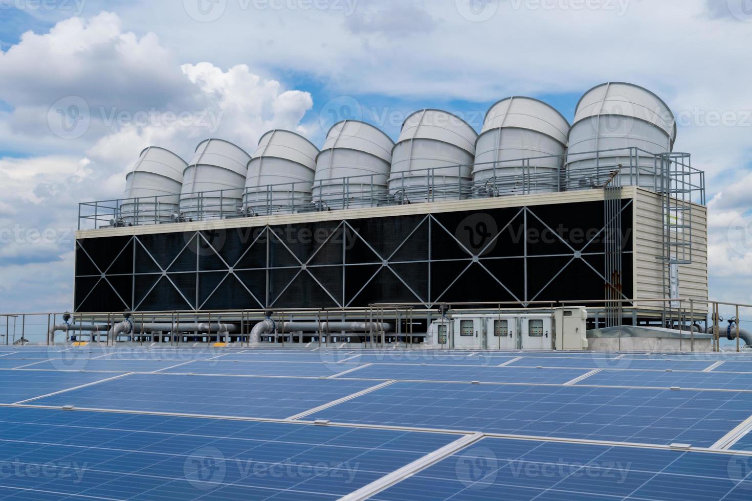 Hot climate and Sets of cooling towers cause increased power production,Alternative energy to conserve the world's energy, rooftop solar and cooling systems. photo