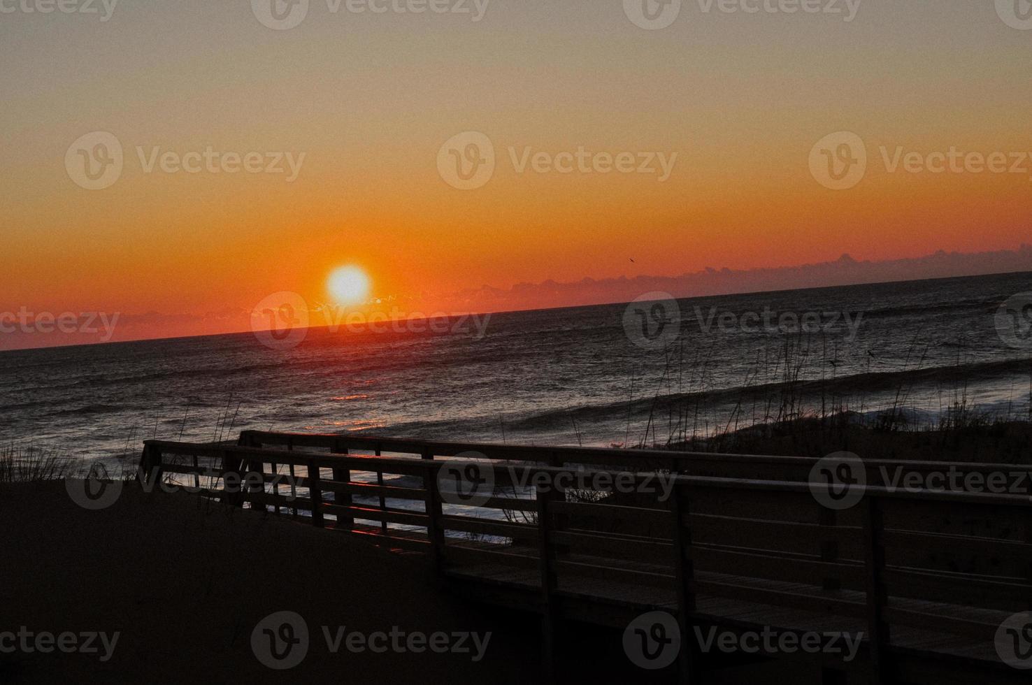 Sunrise over the ocean photo