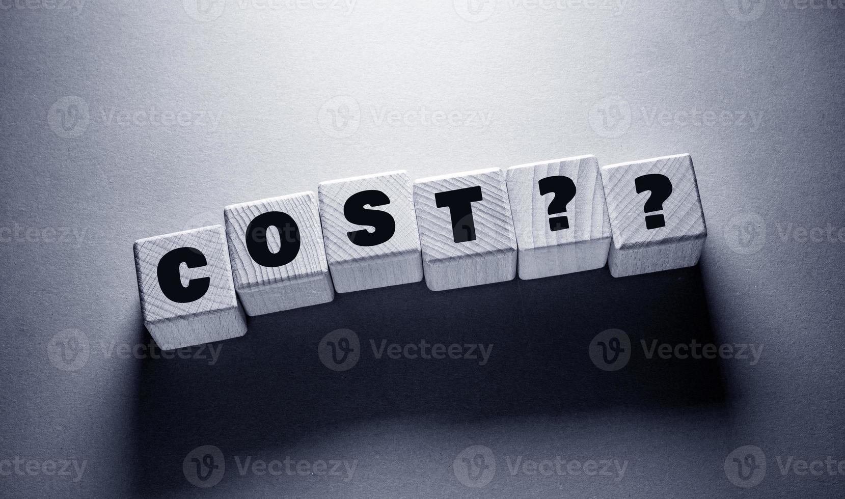 Cost Word with Wooden Cubes photo