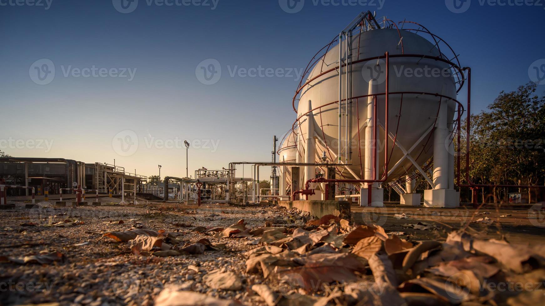 white propane tank with a fuel gas pipeline in the morning. photo