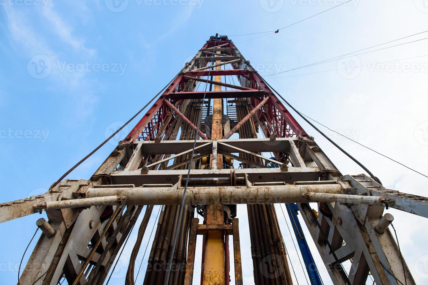 Oil and Gas Drilling Rig. Oil drilling rig operation on the oil platform in oil and gas industry. Top drive system of drilling rig. photo