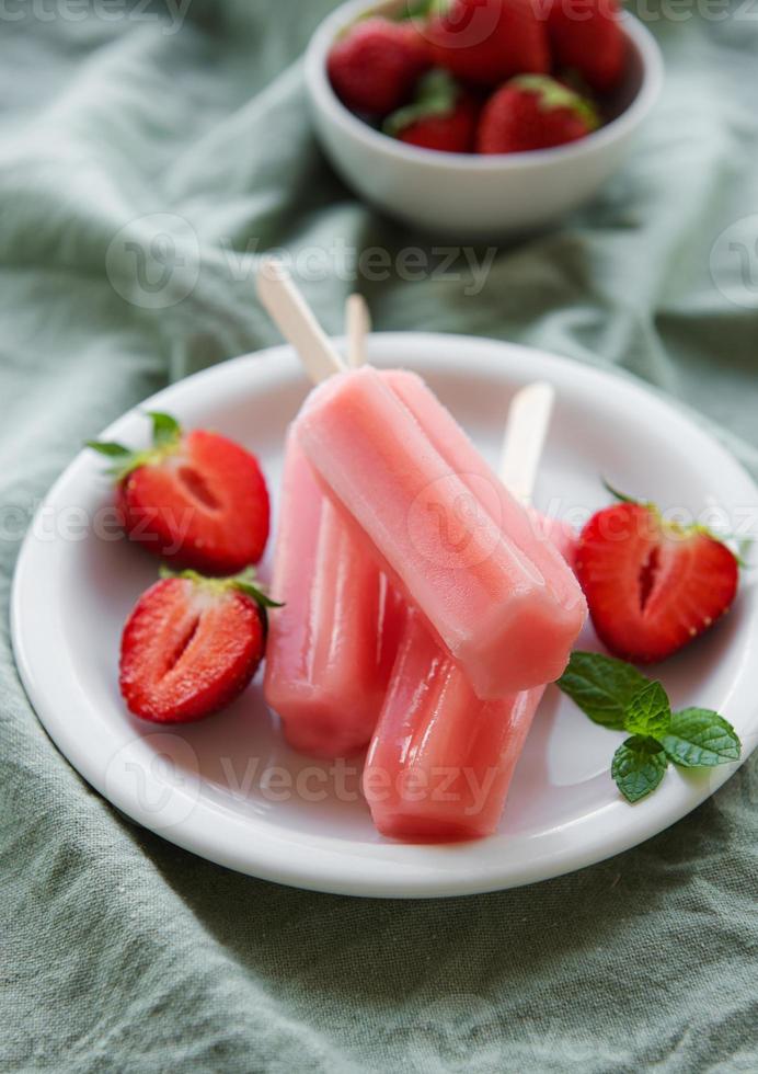 Strawberry ice cream popsicles photo