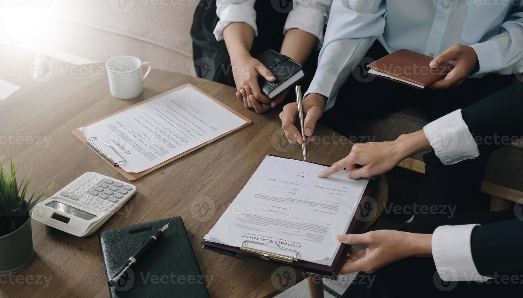 Real estate agent explaining and let customers sign a house purchase contract, discussing for contract to buy house, real estate concept and background. photo