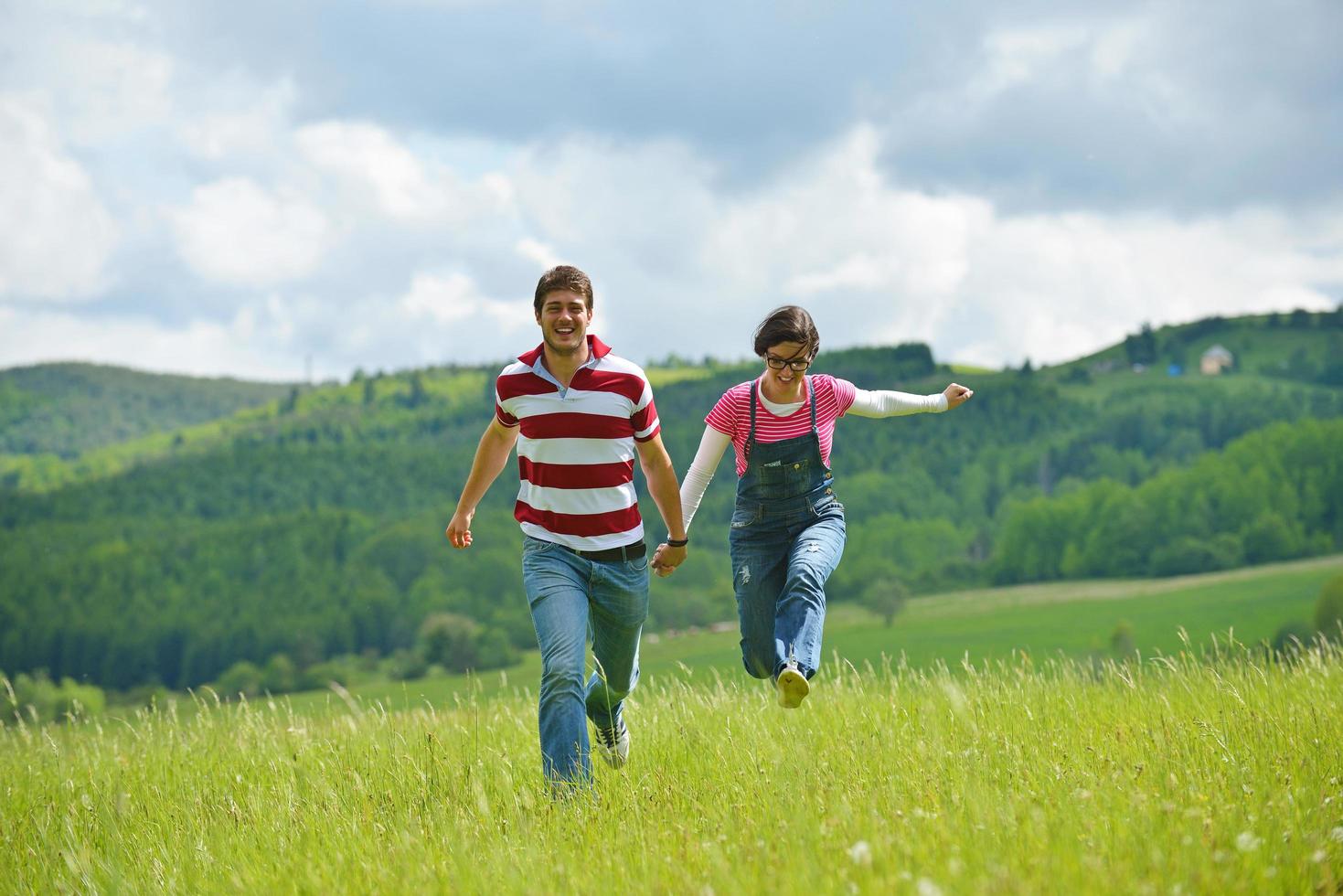 Portrait of romantic young couple smiling together outdoor photo