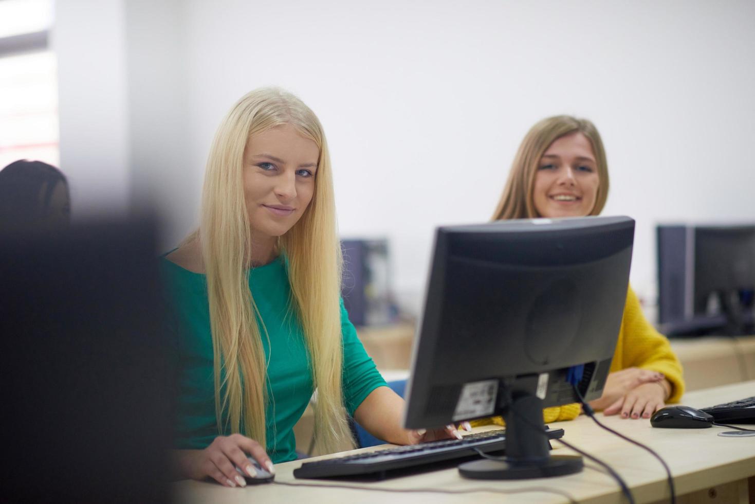 students group in computer lab classroom photo