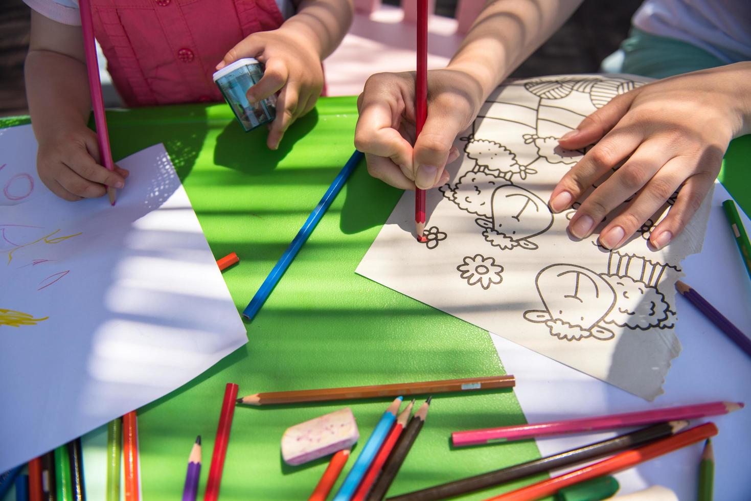 mom and little daughter drawing a colorful pictures photo