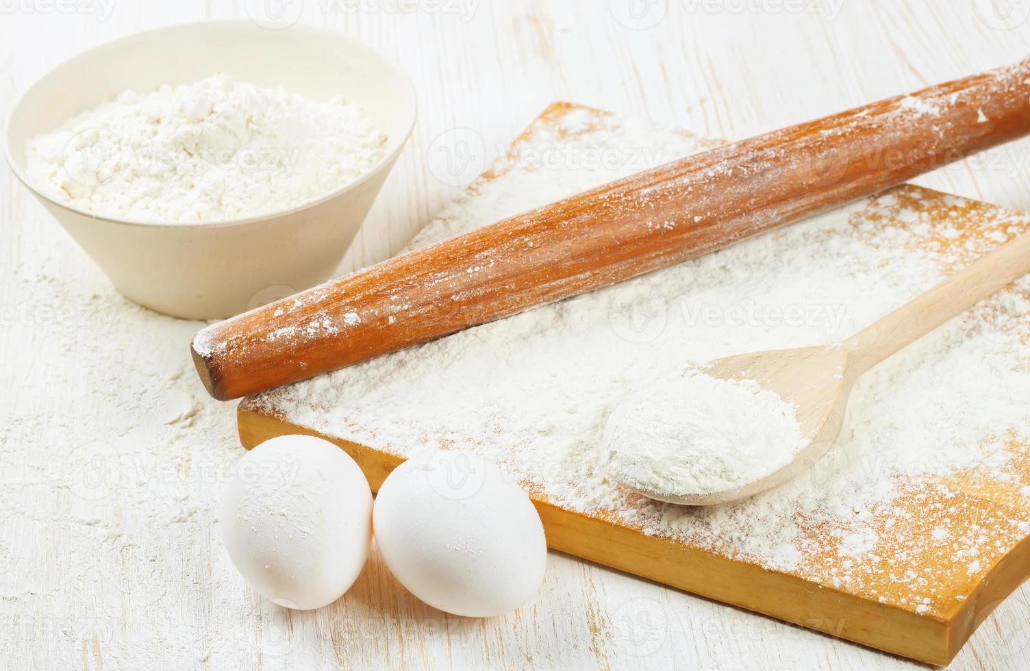 Baking ingredients on white wooden background photo