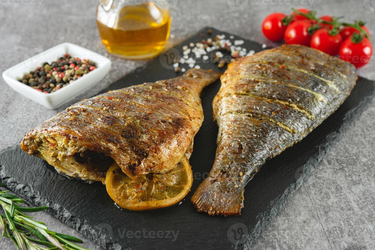 Grilled fish with roasted with lemon and spices photo