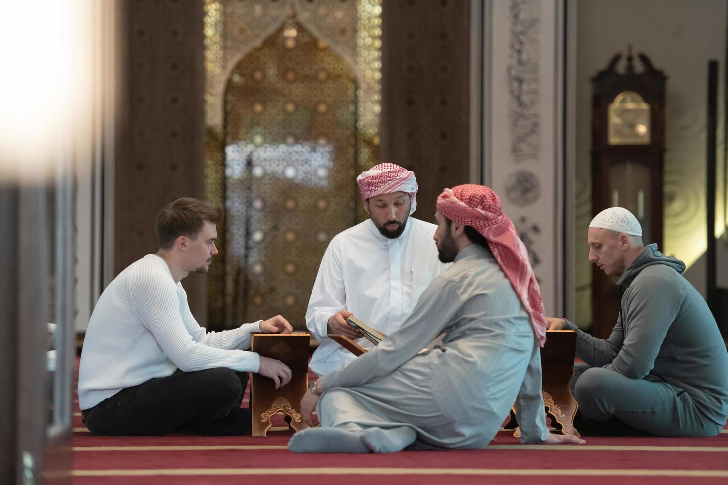 muslim people in mosque reading quran together photo