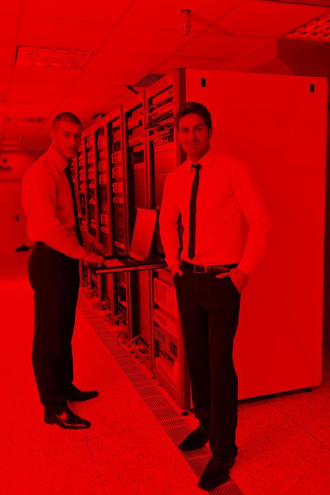 it engineers in network server room photo