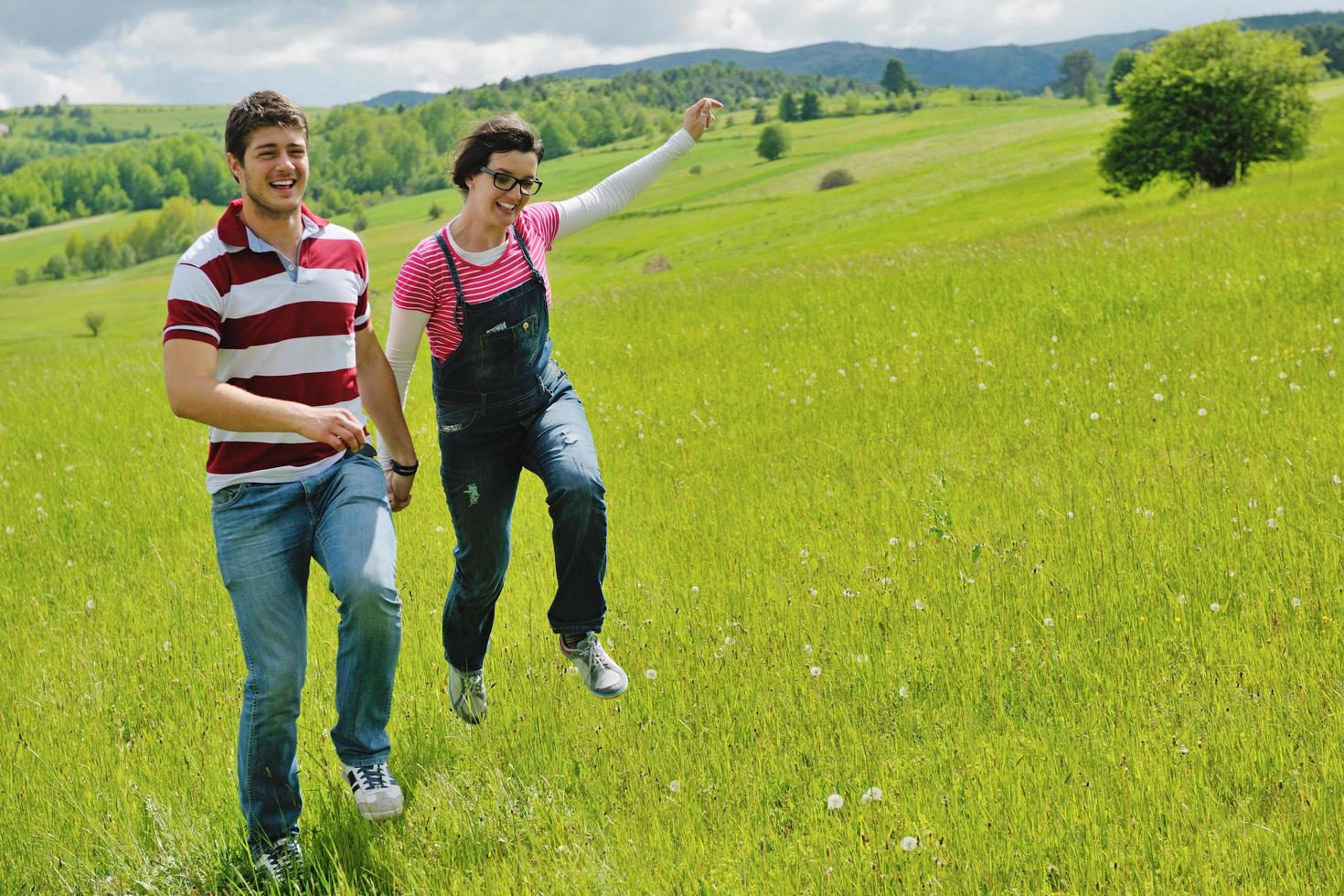 Portrait of romantic young couple smiling together outdoor photo
