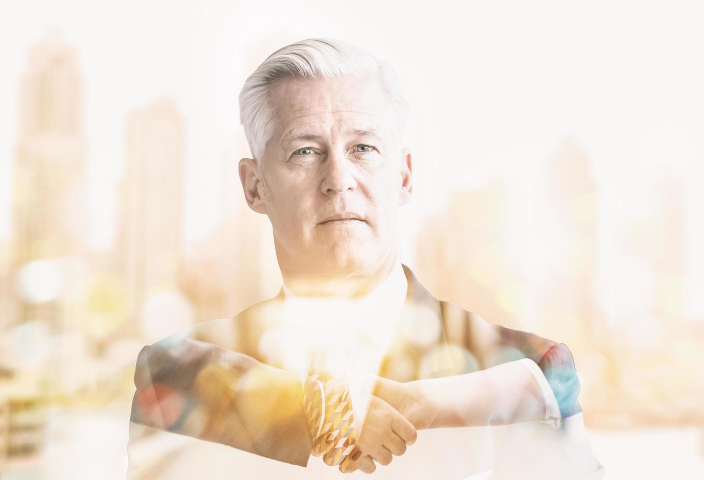 Double exposure of senior businessman photo