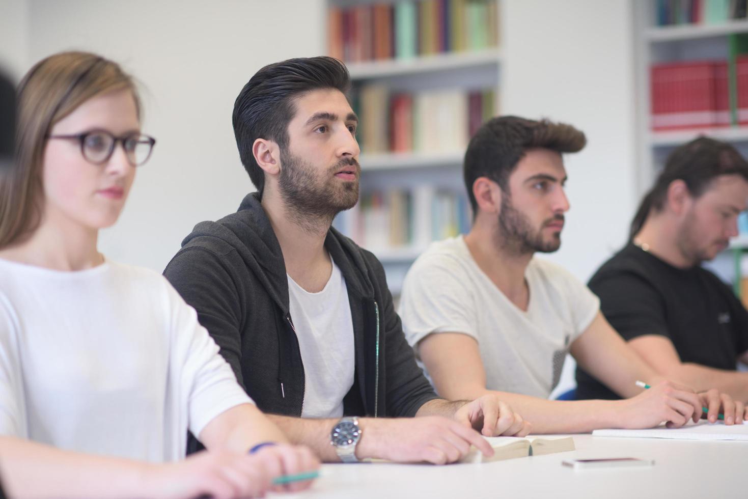 group of students study together in classroom photo