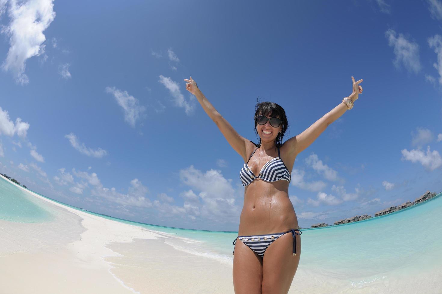 beautiful young woman  on beach have fun and relax photo