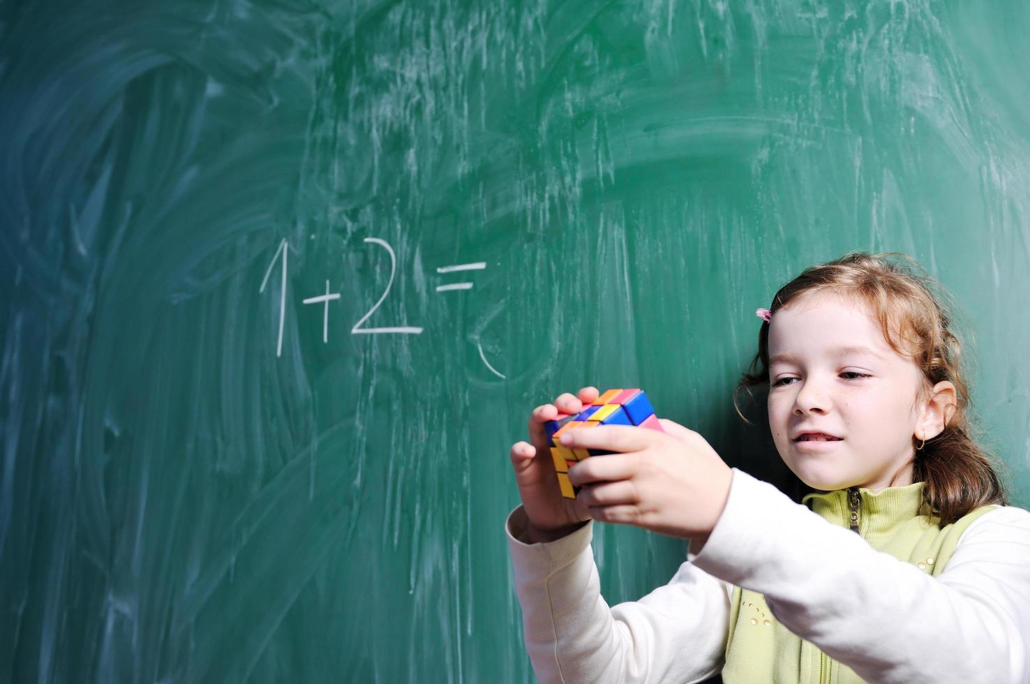 happy school girl on math classes photo