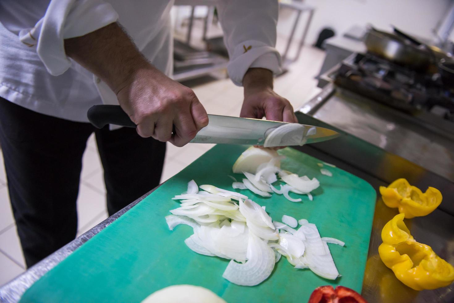 Chef hands cutting fresh and delicious vegetables photo