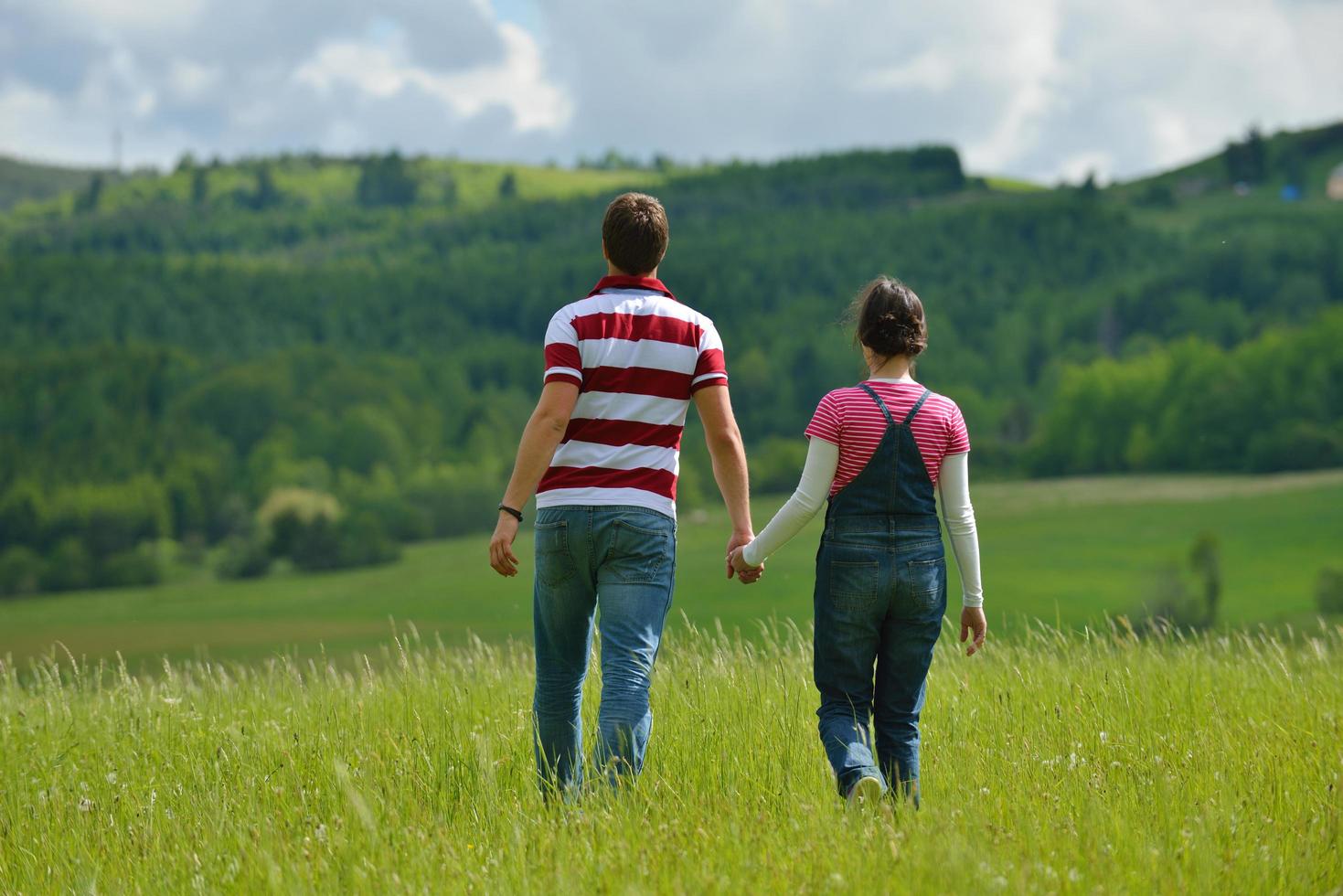 Portrait of romantic young couple smiling together outdoor photo