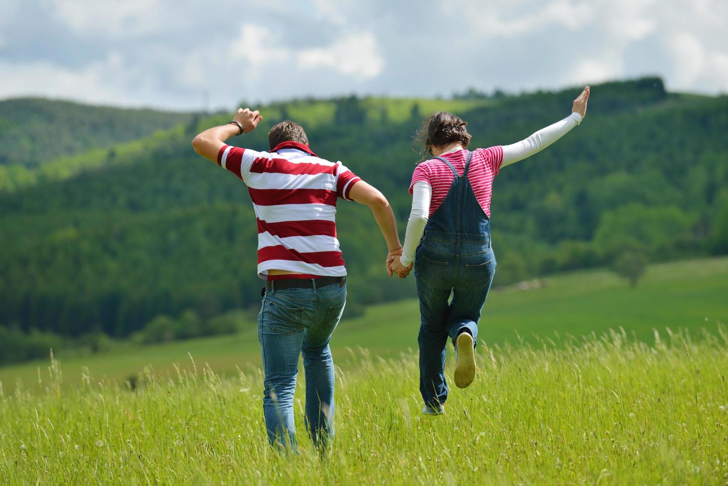 Portrait of romantic young couple smiling together outdoor photo