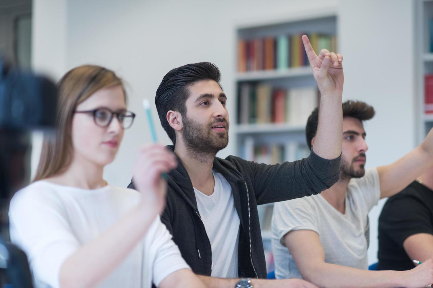 group of students study together in classroom photo